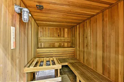 a wooden sauna with a bench in the middle at Private Pool Family-Friendly Kissimmee Townhome! in Kissimmee