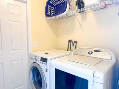 a washer and dryer in a laundry room at EP1051SEL - Private Vacation Pool Home Near Disney in Kissimmee
