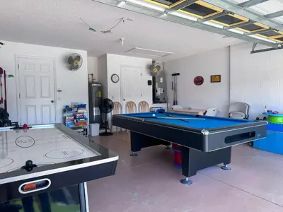 a room with a pool table in a room at EP1051SEL - Private Vacation Pool Home Near Disney in Kissimmee