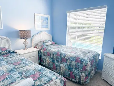 a bedroom with two beds and a window at EP1051SEL - Private Vacation Pool Home Near Disney in Kissimmee