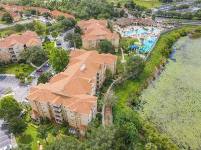 an aerial view of a house with a pool at WH7660-205CS - Lakeview on the hills in Orlando