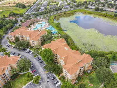 an overhead view of a resort with a pool and a lake at WH7660-205CS - Lakeview on the hills in Orlando