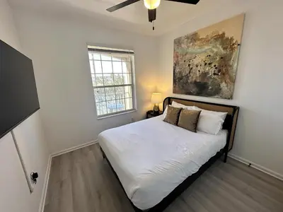 a bedroom with a bed and a painting on the wall at WH7660-205CS - Lakeview on the hills in Orlando