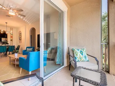 a patio with a couch and chairs and a table at WH2778-201AL - Toy Story meets Star Wars in Orlando