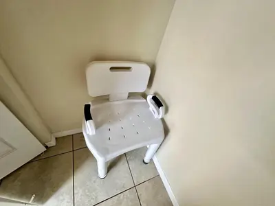 a white toilet in a corner of a room at EP1015SEL - 4 bedrooms - 8 guests pool home on a lake in Kissimmee