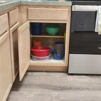 a kitchen cabinet with bowls and plates in it at 4 Bedroom villa in Lake Berkley, Private Pool Fantastic View, Free WiFi, Theme Parks All Around! in Kissimmee