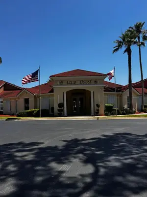 a building with a flag in front of a street at Your Home Away from Home! in Kissimmee