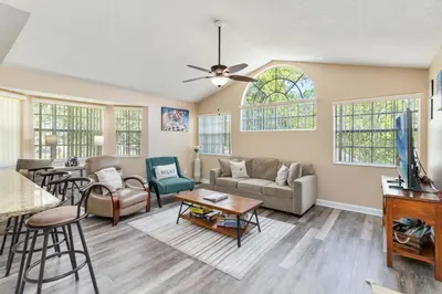 a living room with a couch and a table at Dream Condo in Kissimmee