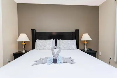 a bedroom with a bed with a blue bow on it at Cozy Apartment 3BD2BA at Windsor Hills WH28131 in Orlando