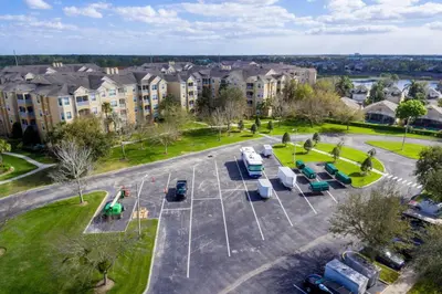 an aerial view of a parking lot with parked vehicles at Cozy 3BR2BA Condo at Windsor Hills Resort WH76604 in Orlando