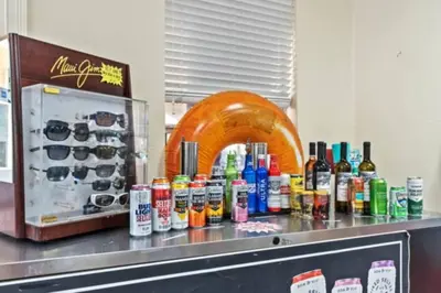 a counter with a bunch of bottles of alcohol at Windsor Hills Magic,Resort Waterslides,Pool,Disney in Orlando