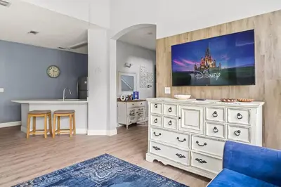a kitchen and living room with a large white dresser at New Listing Just remodeled 4 BR - ER2739 in Kissimmee