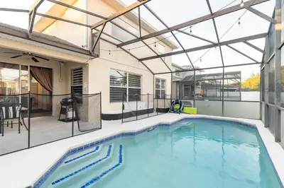 an indoor swimming pool with a glass ceiling at Amazing Star Wars & Disney Vr Gaming House! in Kissimmee