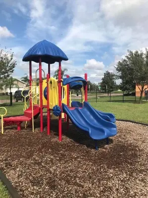 a playground with three slides in a park at Amazing Star Wars & Disney Vr Gaming House! in Kissimmee