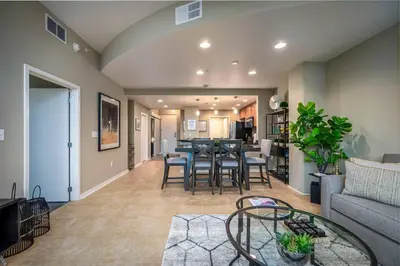 a living room with a couch and a table at Stunning & Luxurious 2Bed 2Bath Open floor plan in Orlando