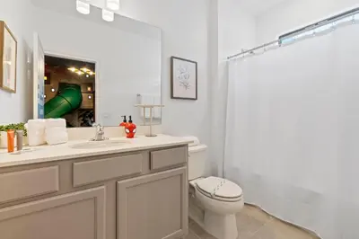 a bathroom with a sink and a toilet and a shower at Brand NEW 12Bed12Bath At Paradiso Grande in Orlando