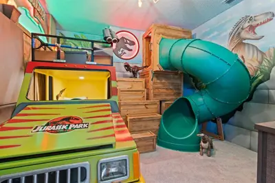a childs play room with a dinosaur slide at Brand NEW 12Bed12Bath At Paradiso Grande in Orlando