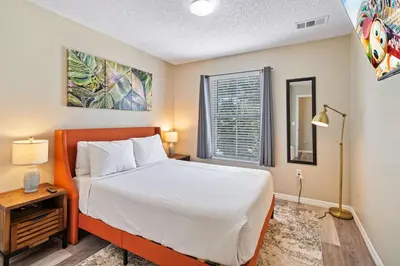 a bedroom with a bed and a window at 8400 Blue Lagoon Drive in Kissimmee