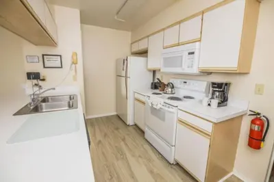a kitchen with white appliances and a sink at CM3 SW030-2F in Kissimmee