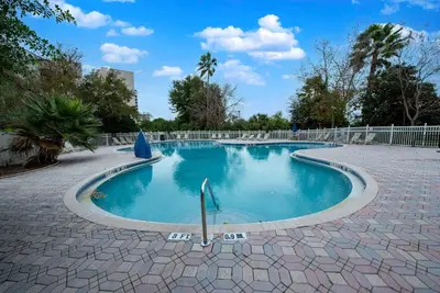 a small swimming pool in a brick walkway at Studio Close to Universal Intl Drive in Orlando