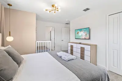 a bedroom with a bed and a ceiling fan at 4327 Create Memories in a Magical 5BD Home in Kissimmee