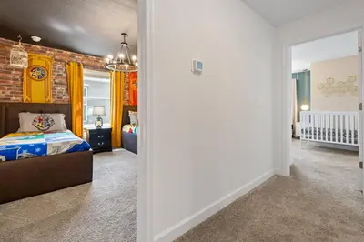 a bedroom with a bed and a brick wall at 4327 Create Memories in a Magical 5BD Home in Kissimmee