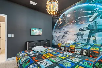 a bedroom with a star wars poster on the wall at 4327 Create Memories in a Magical 5BD Home in Kissimmee