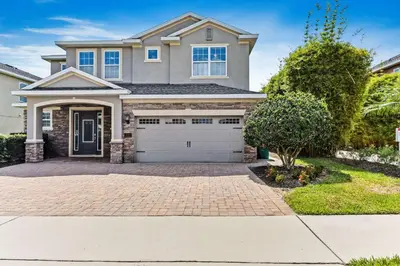 a large house with a driveway at Magic Manor in Orlando