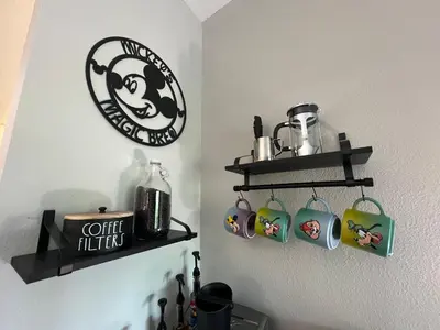 a room with shelves with coffee cups and a clock at DisneyShuttleKing & Queen Be 5 minutes to Disney in Orlando