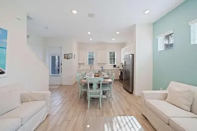 a kitchen and living room with a table and chairs at 3050 Pirate Way in Orlando