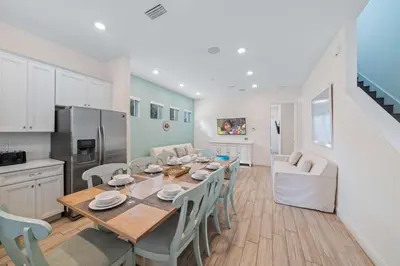 a kitchen and dining room with a table and chairs at 3050 Pirate Way in Orlando