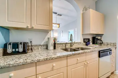 a kitchen with a sink and a counter top at 6 Mi to Disney Kissimmee Resort Vacation Rental! in Kissimmee