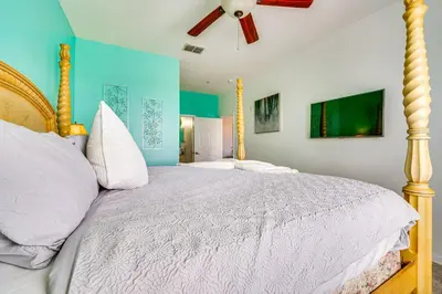 a bedroom with a bed and a ceiling fan at 6 Mi to Disney Kissimmee Resort Vacation Rental! in Kissimmee