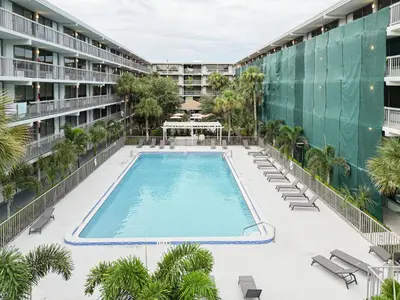 an overhead view of a swimming pool in an apartment building at Modern Orlando 1BR Home & minutes to Disney in Kissimmee