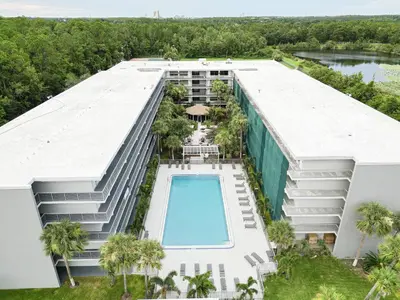 an aerial view of a building with a swimming pool at Modern Orlando 1BR Home & minutes to Disney in Kissimmee