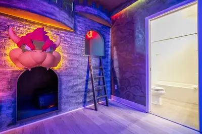 a room with a room with a brick wall at Sea World neighbor Deluxe Home Up to 33 ppl 5800 in Orlando