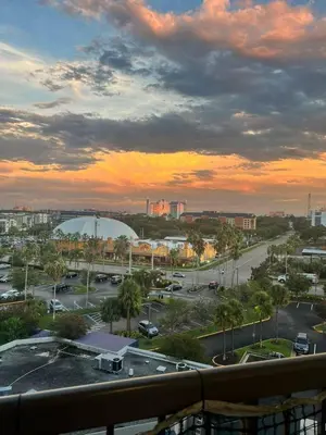 a view of a parking lot at sunset at Renovated and cozy apartment near universal in Orlando