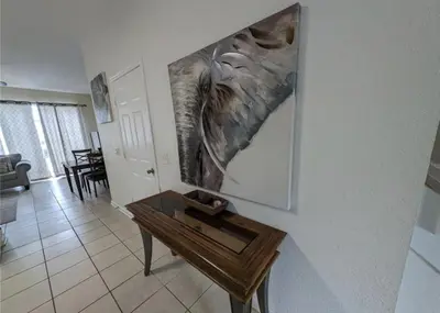 a painting of an elephant hanging on a wall at Beautiful 3 bed townhome in Windsor Hills Resort townhouse in Orlando