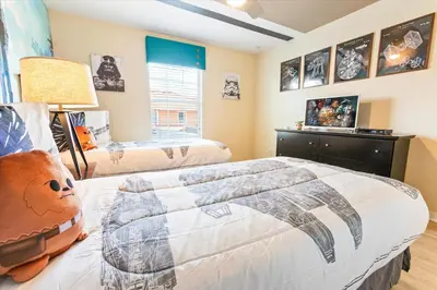 a bedroom with two beds and a window at 8955 California Palm in Kissimmee