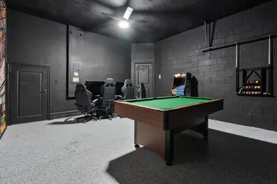 a gaming room with a pool table and chairs at Cozy New 5Bedrooms At Paradiso Grande in Orlando