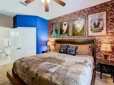 a bedroom with a brick wall and a large bed at C2784-102 Themed Room Free Resort Water Park 3 miles to Disney in Orlando