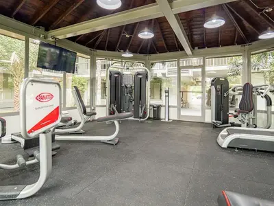 a gym with lots of cardio equipment in a building at Central Orlando 1BR Retreat & minutes to Disney Parks in Kissimmee