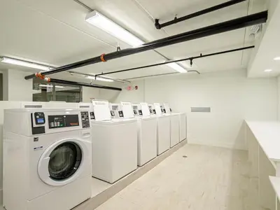a laundry room with a washer and dryer at Orlando 1BR comfort With Lake view minutes to Disney Parks in Kissimmee