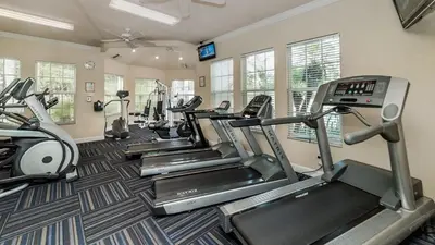 a gym with several tread machines in a room at 2304 Silver Palms #205 in Kissimmee