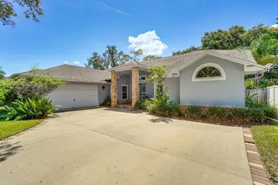 a house with a driveway at Screened Lanai and Fenced Yard Luxe Orlando Home in Orlando