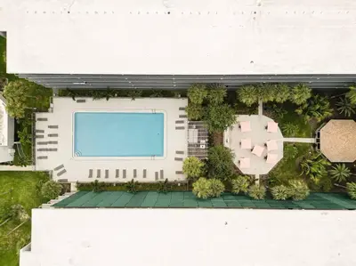 an overhead view of a building with a swimming pool at Spacious 1BR Condo in Orlando and 5 minutes to Disney in Kissimmee