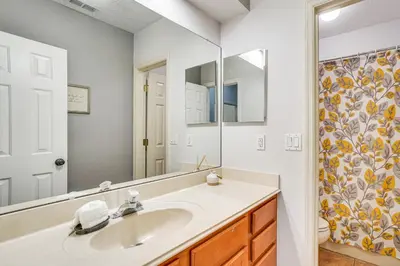 a bathroom with a sink and a mirror at Community Amenities at Spacious Orlando Home! in Orlando