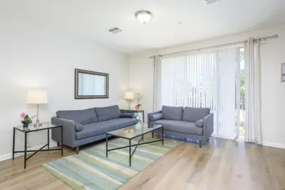 a living room with two couches and a table at Epic Universe New Listing, Family Vacation Townhome - 4011 in Orlando