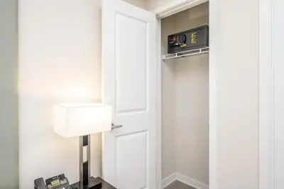 a room with a door and a lamp at Brand New Modern Vista Cay Reserve Condo - 5003 in Orlando