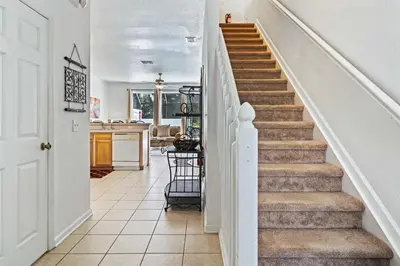 a staircase in a home with white walls at 2533 Renshaw Street in Orlando